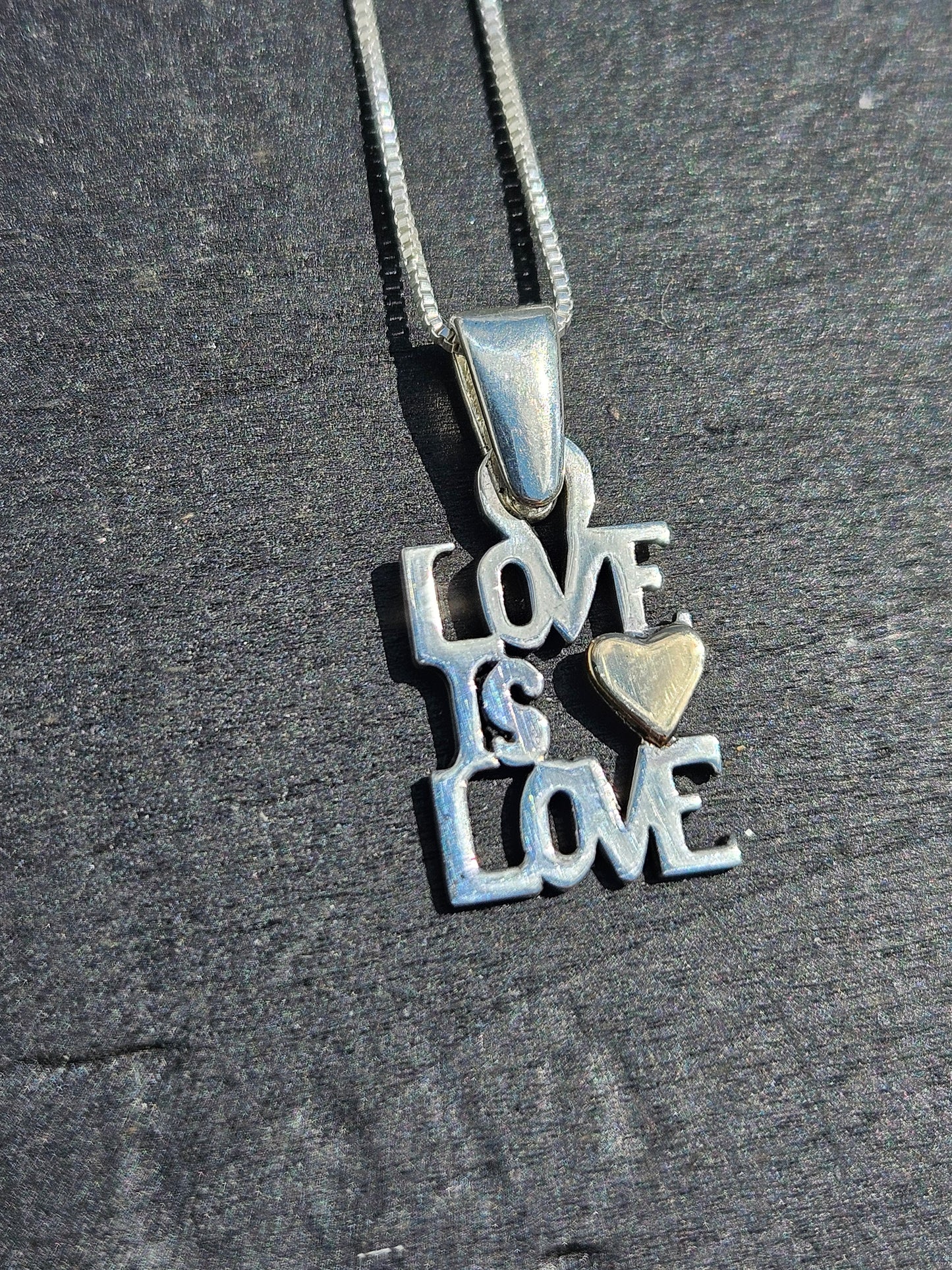"Love Is Love" Pendant. Silver and 14kt Gold.