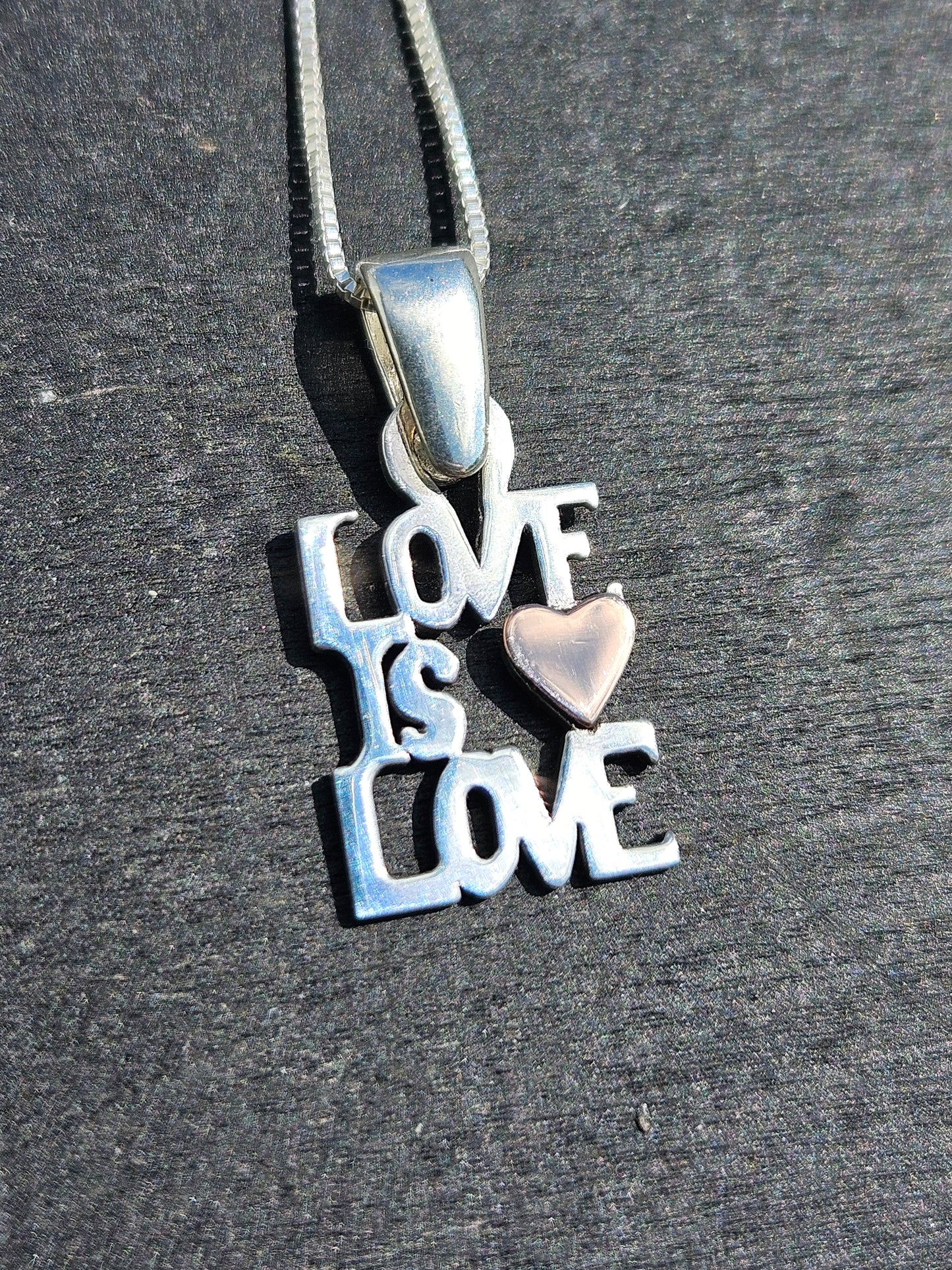 "Love Is Love" Pendant. Silver and 14kt Gold.